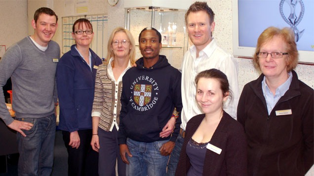 6.	Nkosi poses with the team at Weston Beamor, a precious metal casting house located in Birmingham, UK. 